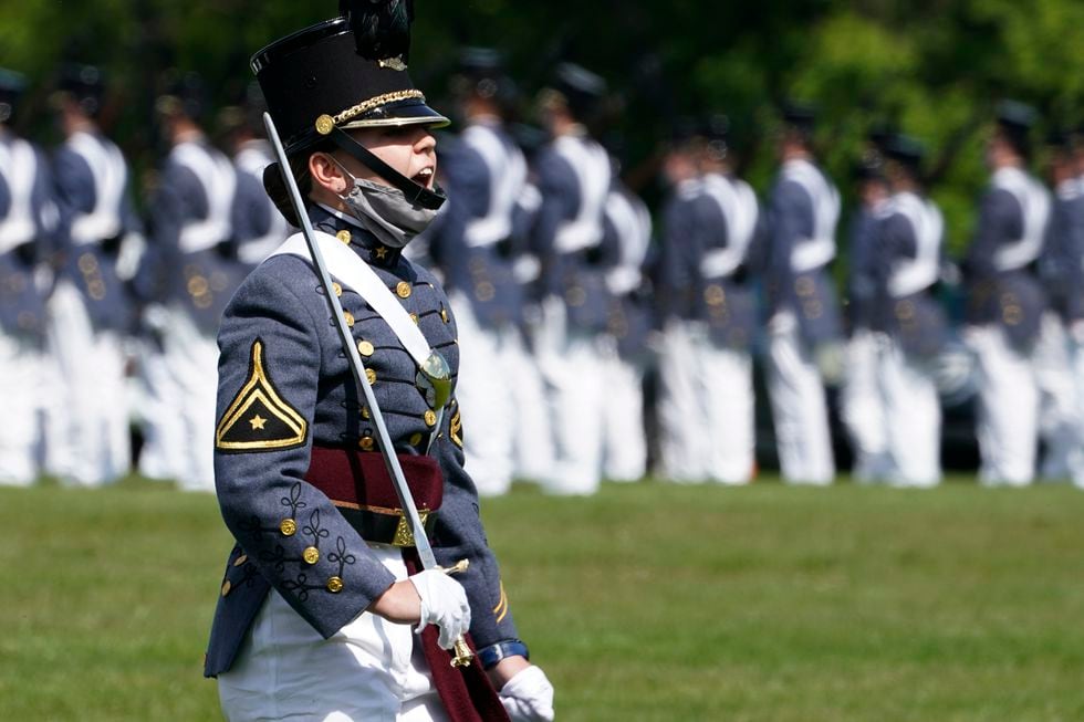Corps of Cadet Commander Kasey Meredith, of Johnstown, Pa., yells a command as she leads the...