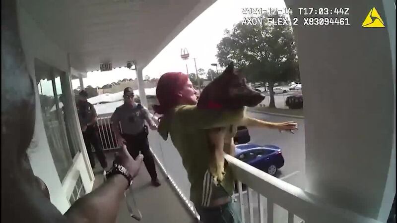 Bodycamera footage shows a woman throwing a dog off a balcony.