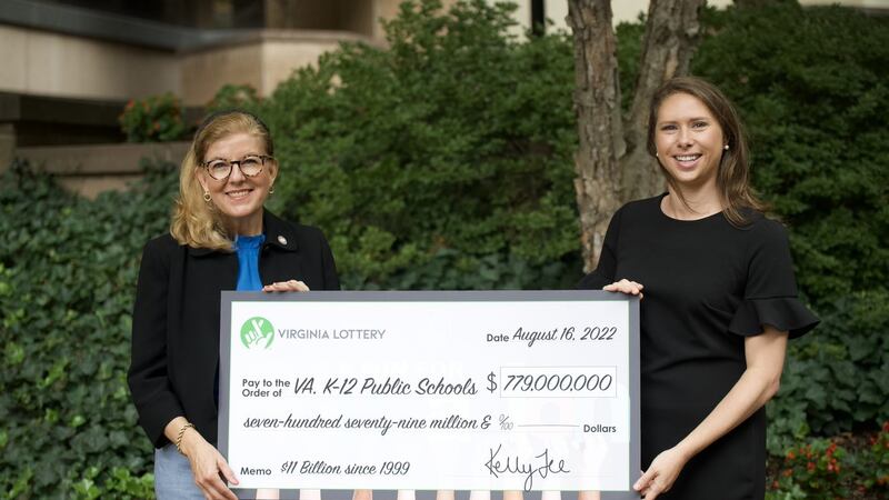 The revenue profits were revealed in the form of a large check Virginia Lottery Executive...