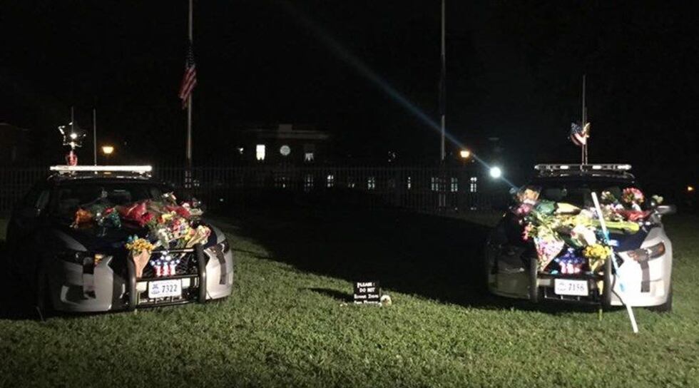 A memorial continues to grow outside Virginia State Police headquarters. (Source: NBC12)