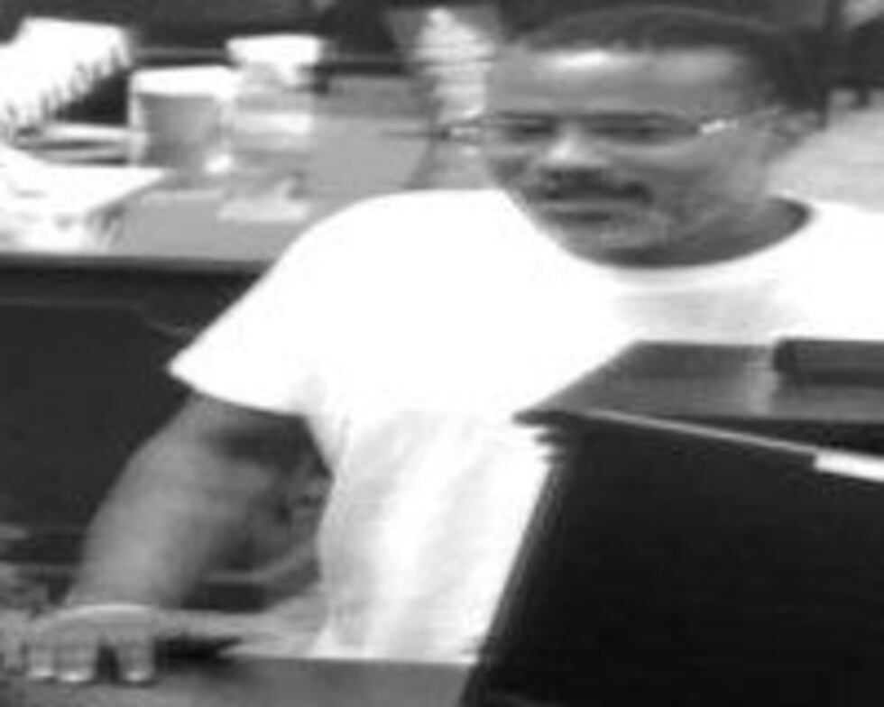 A surveillance image of a man believed to be connected with the attempted bank robbery....