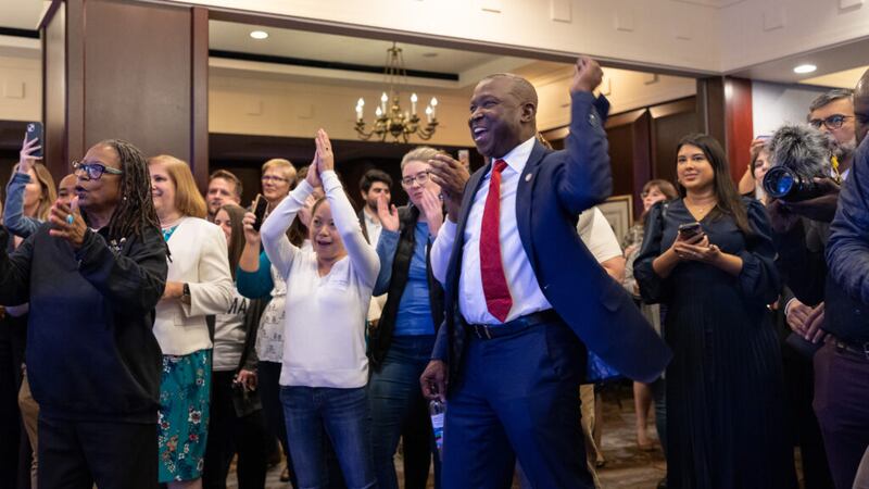 Senator Don Scott (D-Portsmouth) cheers as election results are announced during the...