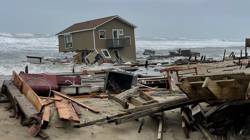 FILE - This image released by the National Park Service, shows a collapsed beachfront home...