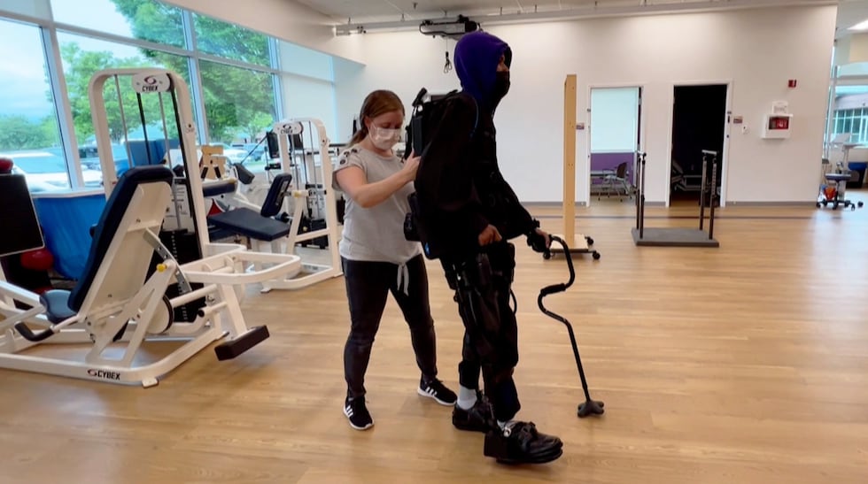 Khalil Watson practices walking with his exoskeleton