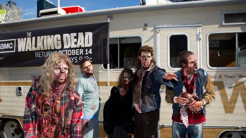 Zombies are seen in front of the Winnebago from the AMC show "The Walking Dead" at...