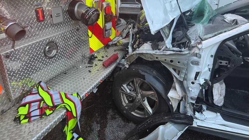 The sedan hit the command truck first, then continued towards first responders before crashing...