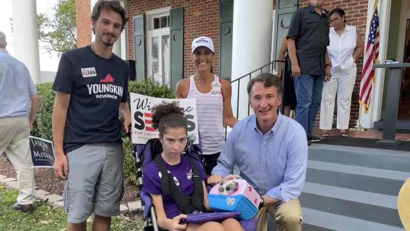 Gov. Glenn Youngkin poses for a photo with Lisa Smith, her daughter Haley and her son Peyton...