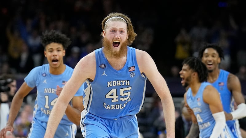 North Carolina's Brady Manek (45) celebrates after beating Duke in a college basketball game...