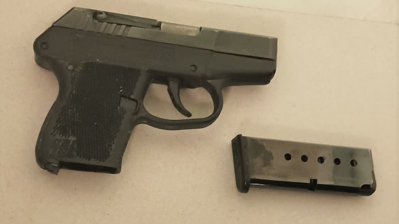Police say the .380 caliber handgun was not loaded when they confiscated it from the woman.