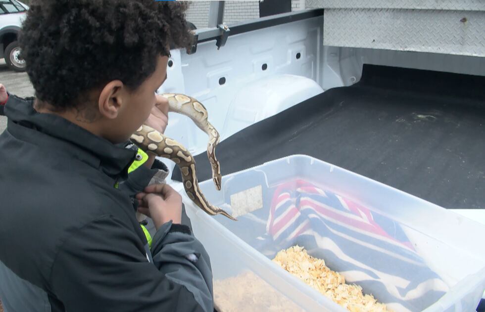 14-year-old Dion Jones reunites with his pet python, "Nate."