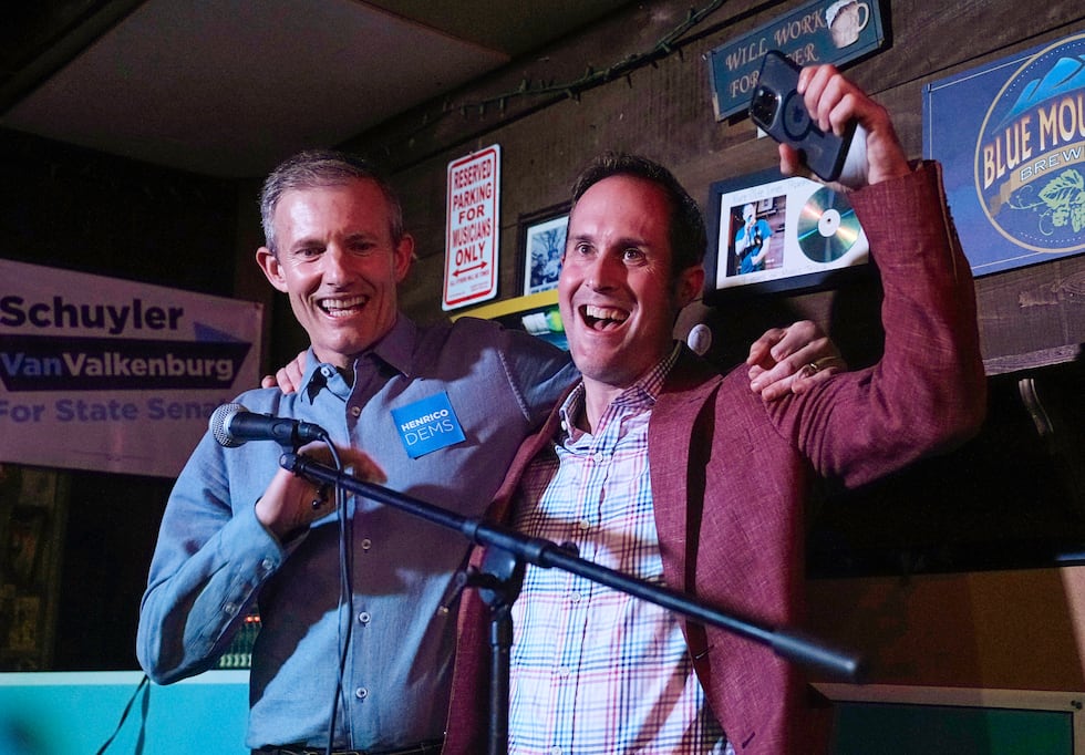 Democrats Del. Schuyler VanValkenburg, right, and Del. Rodney Willett celebrate at an election...