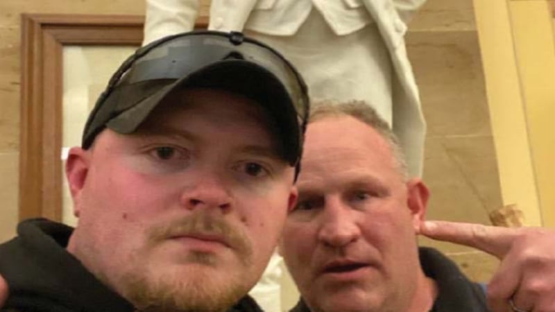 Sergeant Thomas Robertson, right, and Officer Jacob Fracker, left, posted this photograph of...