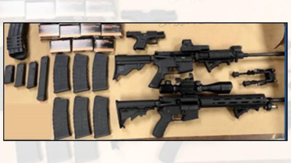 Police seized two rifles, a handgun, a cache of magazines and ammunition during their...