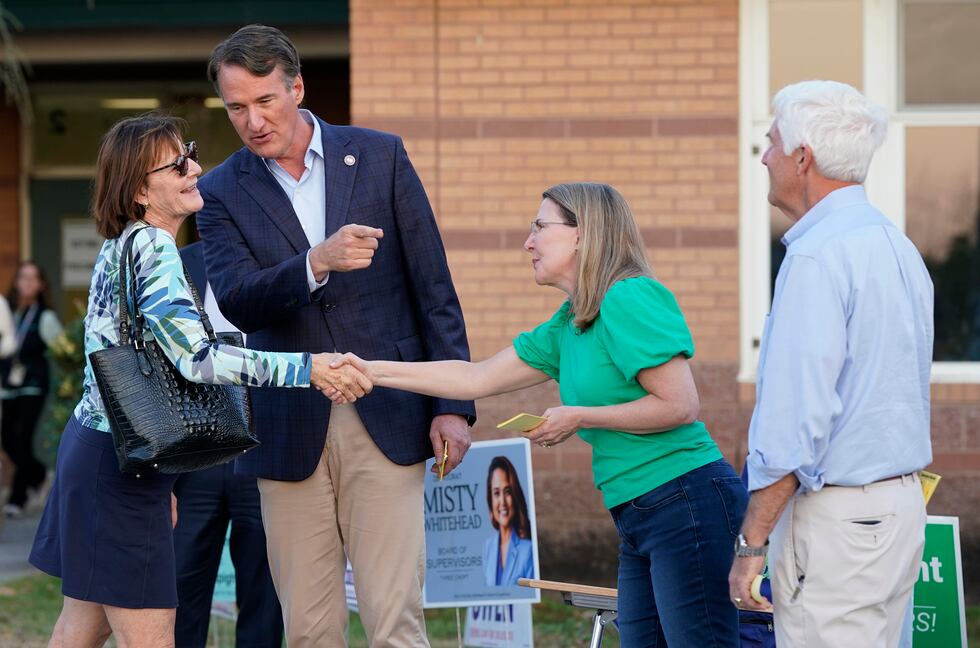 Virginia Gov. Glenn Youngkin, second from left, introduces a voter to Virginia State Sen....