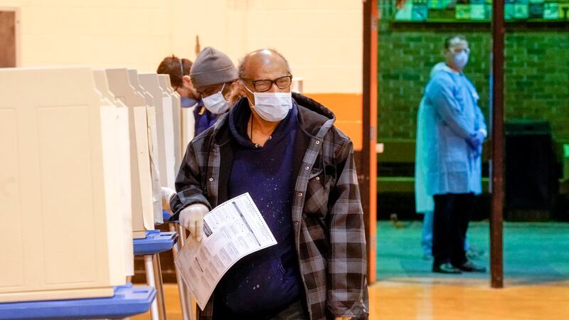 People vote at Riverside High School for Wisconsin's primary election on Tuesday April 7,...